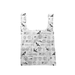 A reusable shopping bag with a white background and a black all-over pattern of stamps, postmarks, and bird silhouettes, shown against a plain white background.
